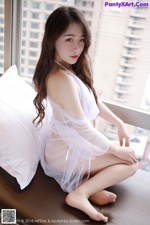 MFStar Vol.116: Model Zhai Tu Tu (宅 兔兔) (43 photos) A woman sitting on a bed in a white lingerie.